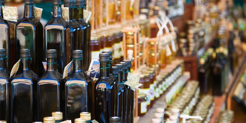 croatian market stall with local olive oil and other goods